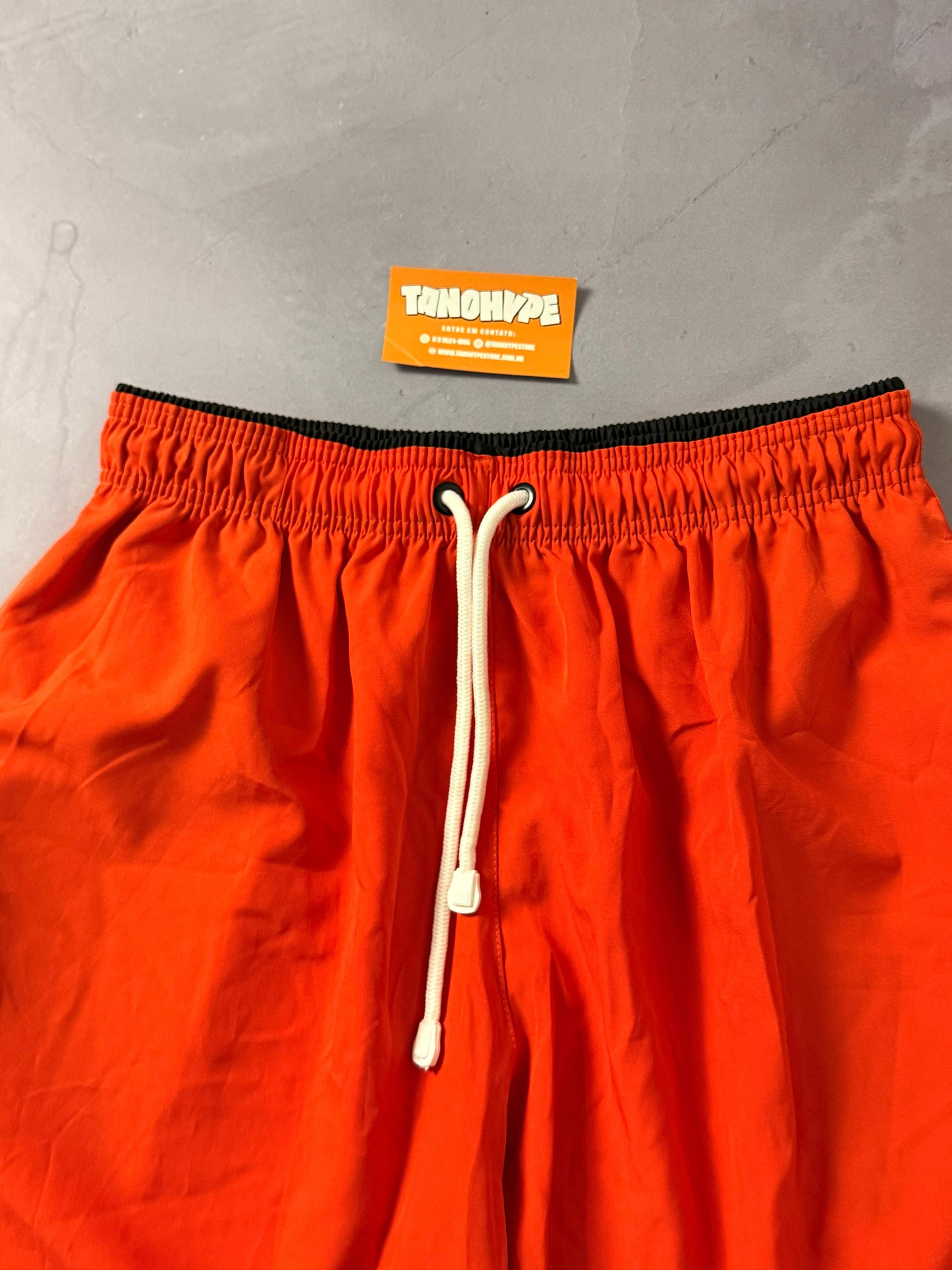 Shorts Tactel Nike Club - Laranja
