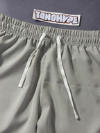 Shorts Tactel Nike Club Flow - Cinza Claro